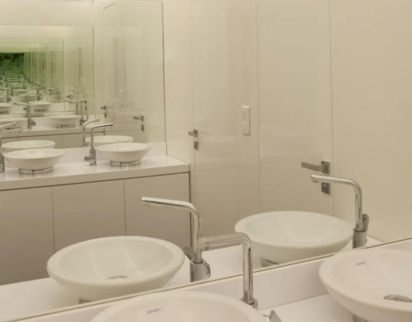 Executive restrooms with white marble vanity countertop