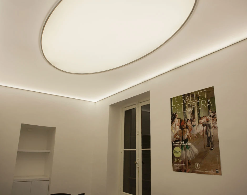 Detail photograph of white marble finish and brass fixtures