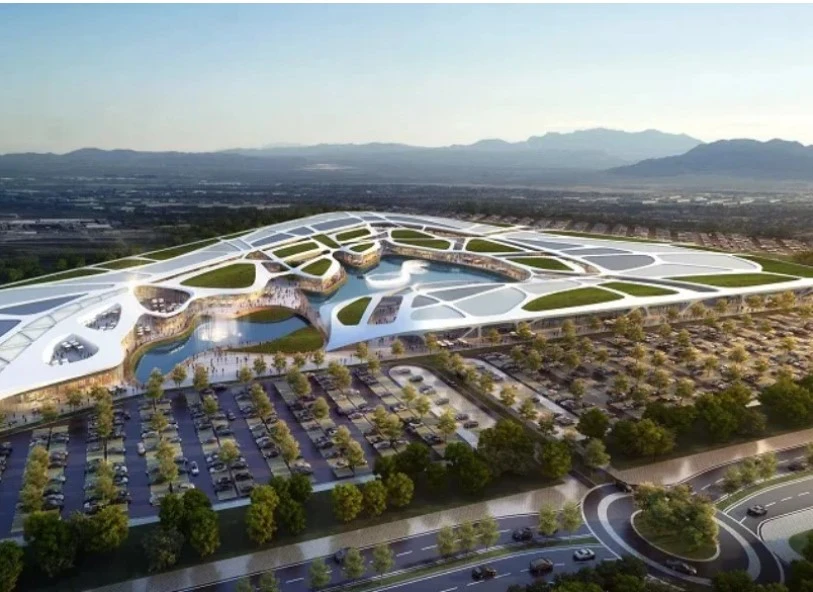 Aerial masterplan render showing lake integration