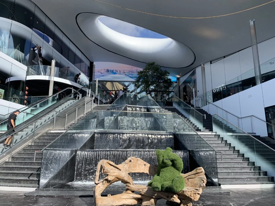 Mon Grand Plaisir — interior cascading waterfall and grand staircases